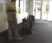 Robot SLAMbot following a human guide.